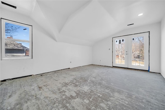 bonus room featuring lofted ceiling and french doors