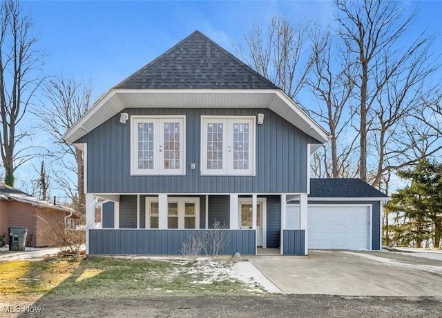 view of front property with a garage and a porch