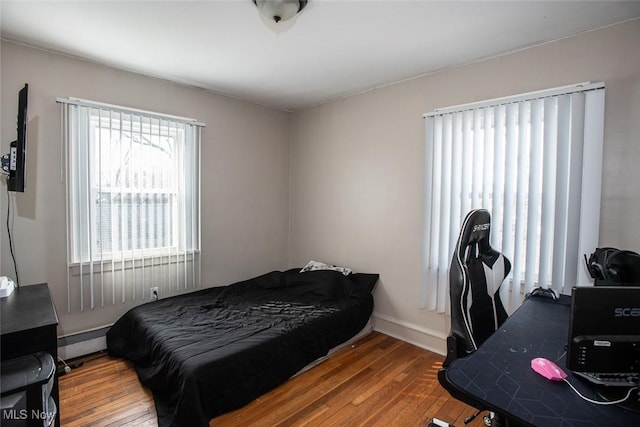 bedroom with hardwood / wood-style floors