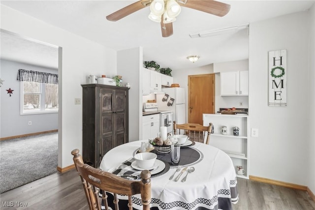 dining space featuring ceiling fan and light hardwood / wood-style flooring