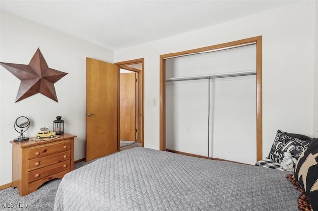 carpeted bedroom with a closet