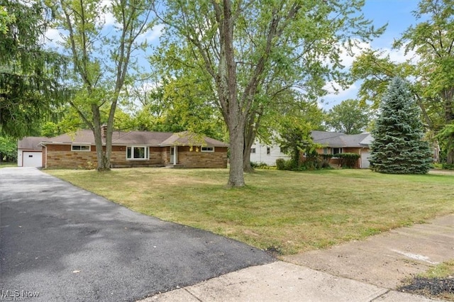 ranch-style home featuring a front yard