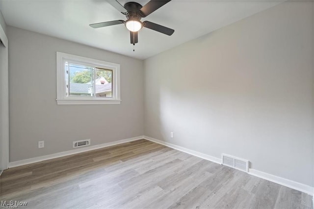 unfurnished room with ceiling fan and light hardwood / wood-style floors