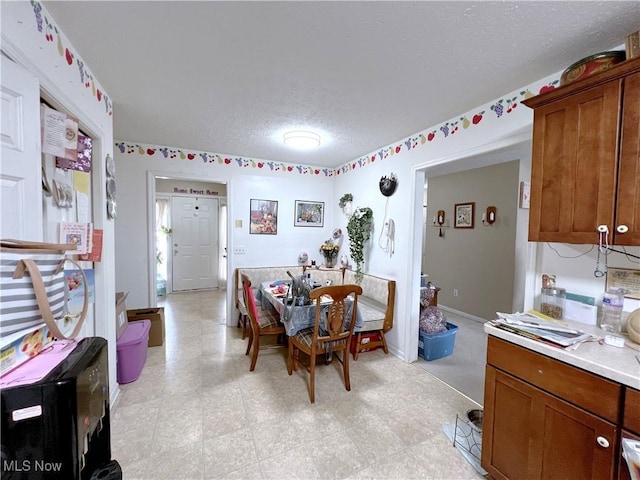 dining room with a textured ceiling