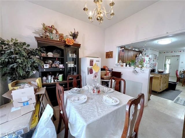 dining room featuring a notable chandelier