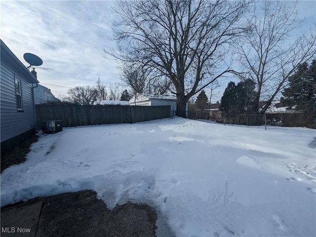 view of yard covered in snow