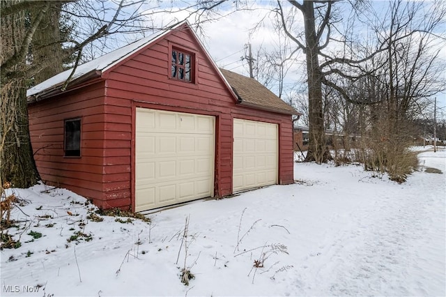 view of snow covered garage