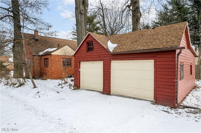 view of snow covered garage