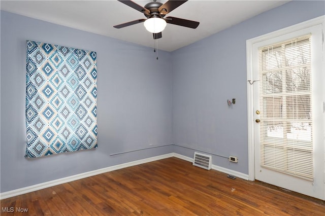 empty room with wood-type flooring and ceiling fan