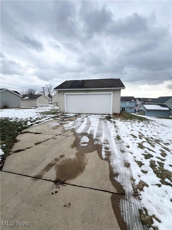 view of snow covered garage