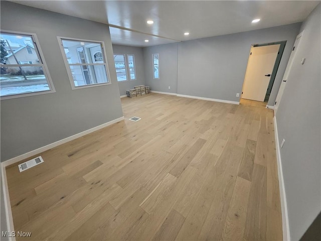 spare room featuring light hardwood / wood-style flooring