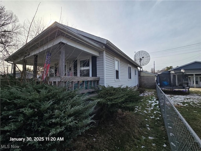 view of property exterior with a trampoline