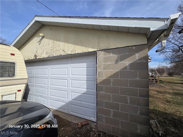 view of home's exterior featuring a garage and an outdoor structure