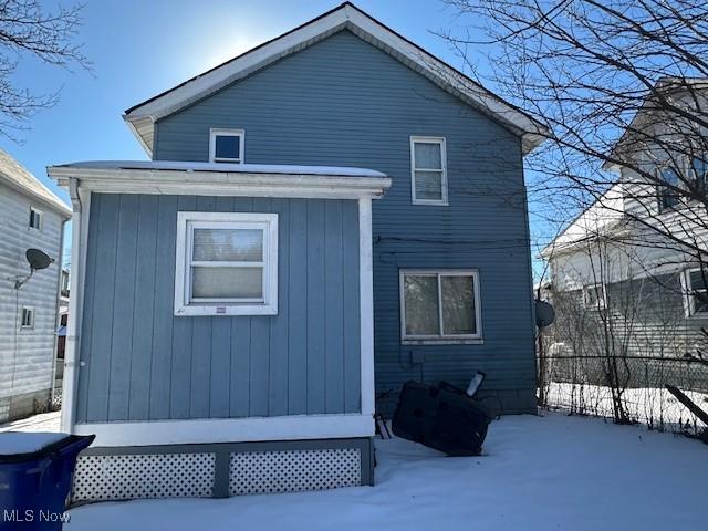 view of snow covered house