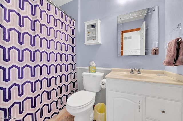 bathroom with vanity, toilet, and a shower with shower curtain