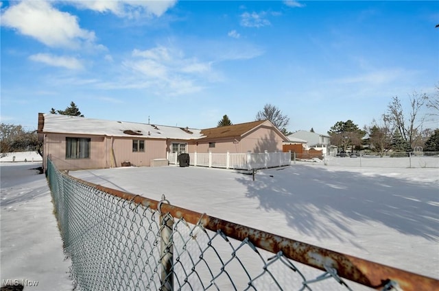 view of snow covered property