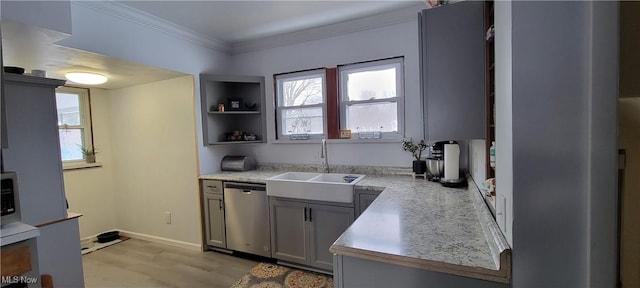 kitchen with sink, gray cabinetry, ornamental molding, stainless steel dishwasher, and light hardwood / wood-style flooring