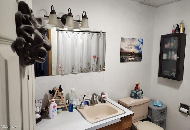 bathroom with vanity and toilet