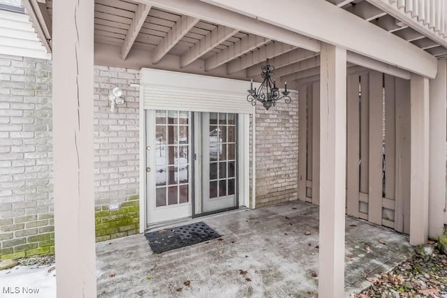 property entrance featuring brick siding