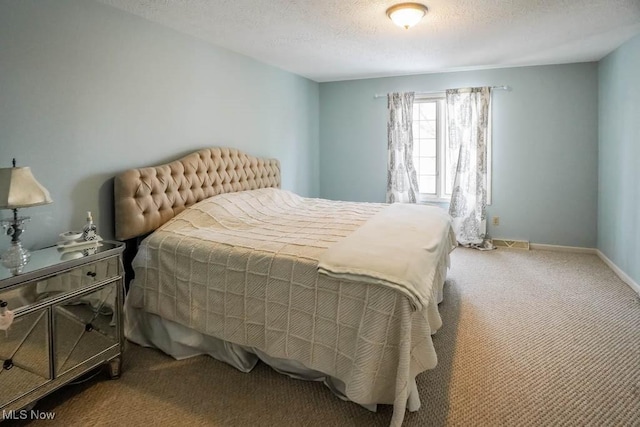 carpeted bedroom with a textured ceiling