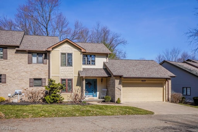 traditional-style home featuring a garage, brick siding, concrete driveway, and a shingled roof