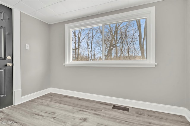 unfurnished dining area featuring a healthy amount of sunlight and light hardwood / wood-style floors