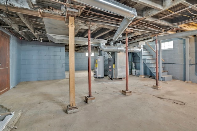 basement with water heater and heating unit