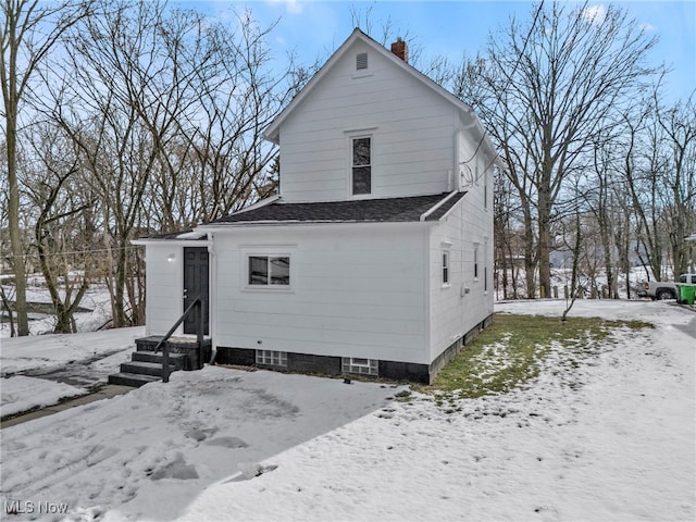 view of snow covered house