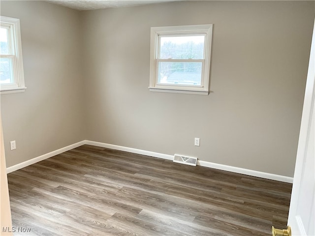 empty room featuring hardwood / wood-style floors