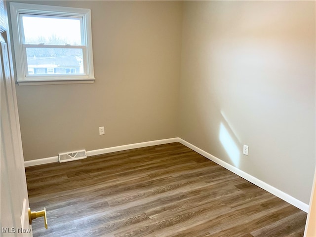 empty room featuring hardwood / wood-style flooring