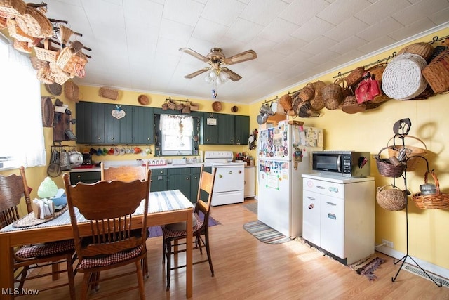 kitchen featuring ornamental molding, light wood-type flooring, ceiling fan, and white appliances