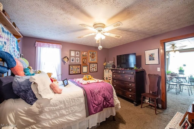 carpeted bedroom with ceiling fan, a textured ceiling, and access to outside