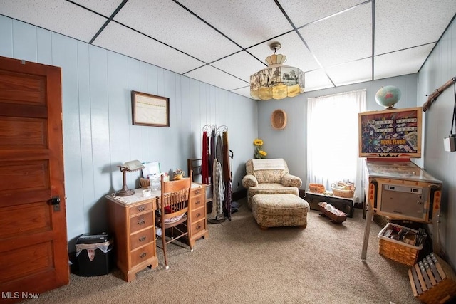 office space with a paneled ceiling and carpet floors