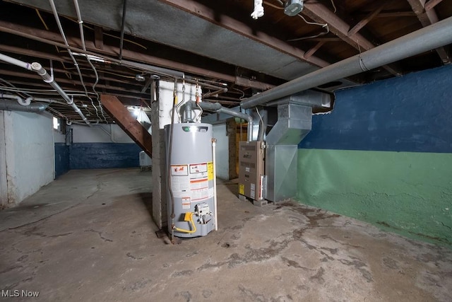 basement featuring water heater and heating unit