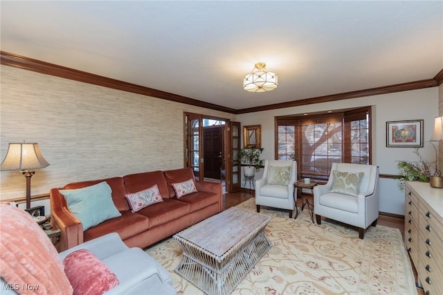 living room featuring crown molding and light hardwood / wood-style flooring