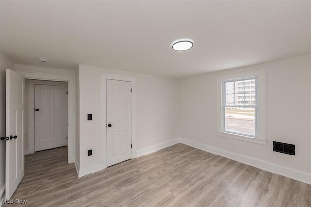 empty room featuring light hardwood / wood-style floors