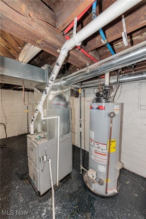 utility room with heating unit and water heater