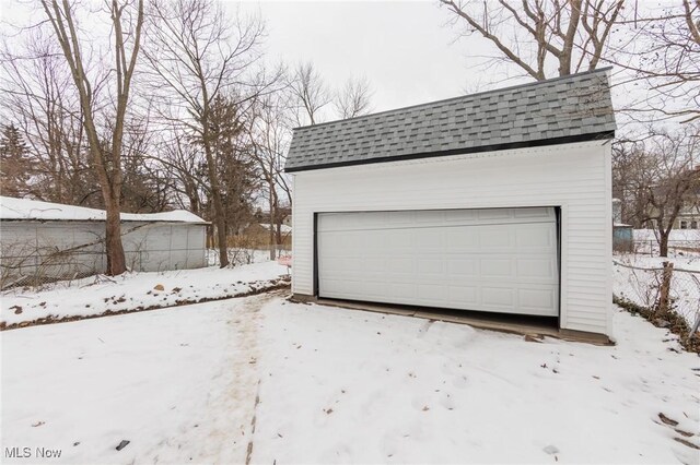 view of snow covered garage