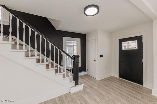 entryway with light hardwood / wood-style flooring