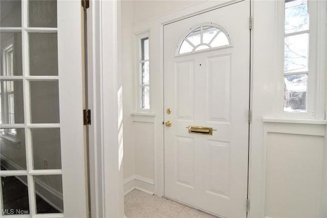 tiled entryway featuring plenty of natural light