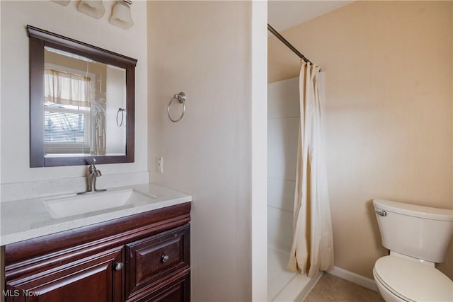 bathroom with vanity, toilet, and a shower with shower curtain