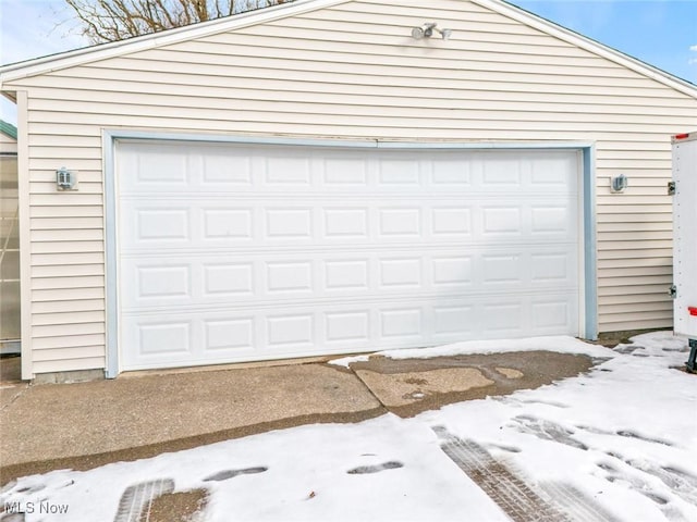 view of snow covered garage