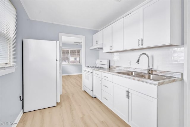 kitchen with white cabinetry, sink, light wood-type flooring, ornamental molding, and white appliances