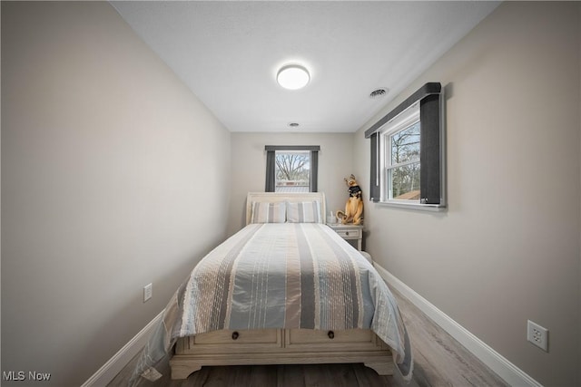 bedroom featuring hardwood / wood-style floors