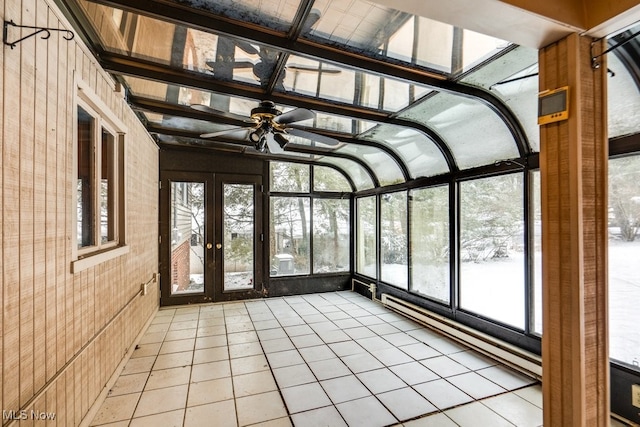 unfurnished sunroom with ceiling fan and plenty of natural light