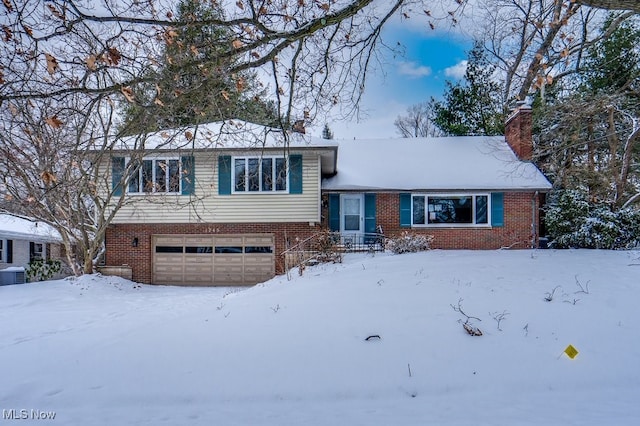 split level home featuring a garage