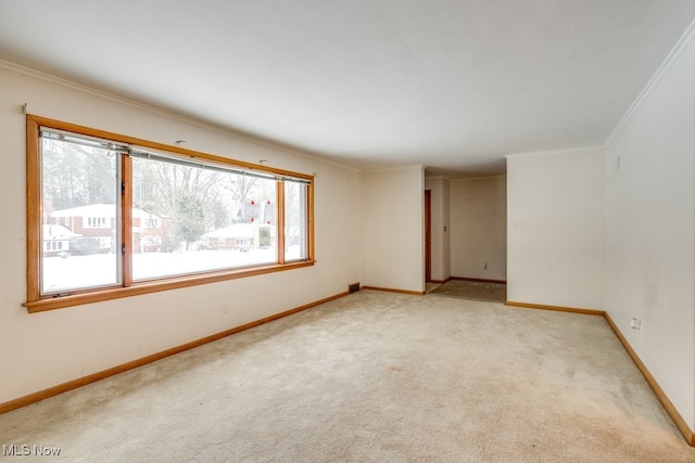 carpeted spare room with ornamental molding