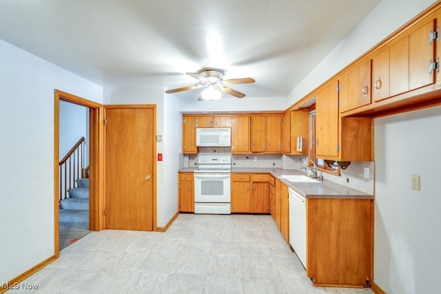 kitchen with ceiling fan, white appliances, sink, and backsplash