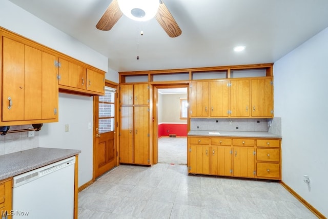 kitchen featuring tasteful backsplash, a healthy amount of sunlight, dishwasher, and ceiling fan