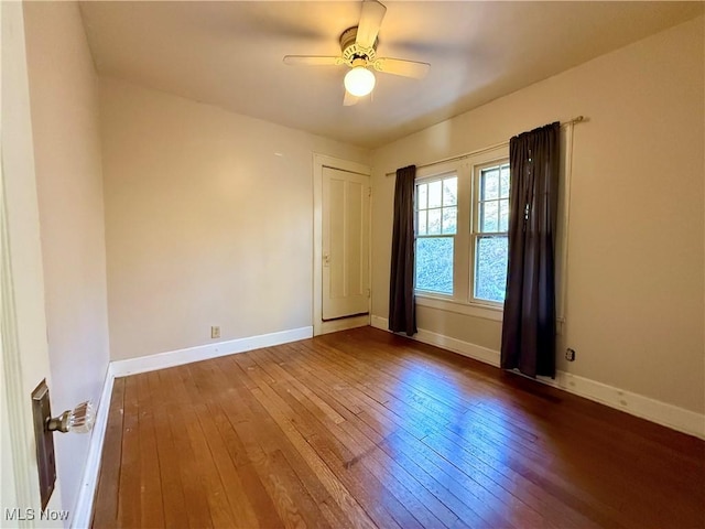 unfurnished room featuring ceiling fan and wood-type flooring